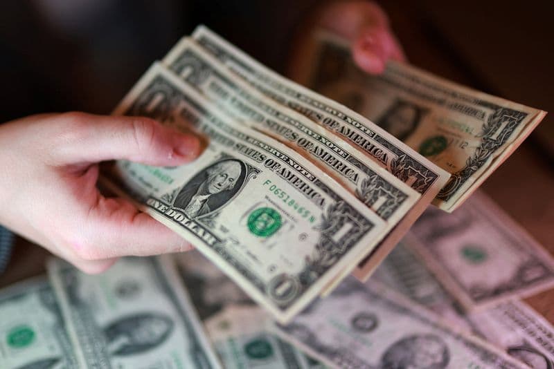 Dollar tumbles versus yen as Japanese officials signal intervention